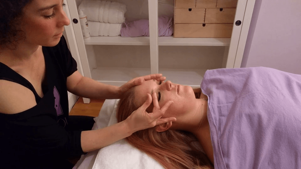 Giving a client a face massage